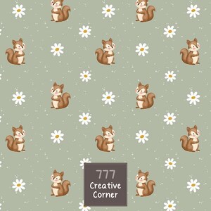 May include: A sage green fabric pattern featuring repeating illustrations of brown squirrels and white daisies with yellow centers, interspersed with small white dots. A dark gray square label displays the text 777 Creative Corner.