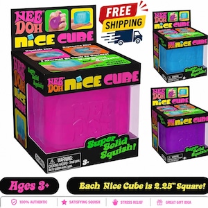 May include: A Nee Doh Nice Cube sensory toy in a bright pink color, packaged in a black box with the text Nee Doh Nice Cube and Super Solid Squish. The packaging indicates the cube measures 2.25 inches square and is intended for ages 3 and up.