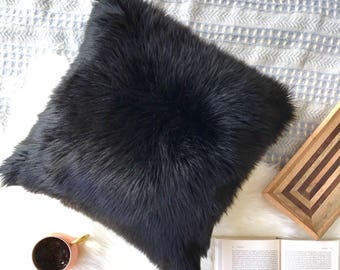 black fluffy pillows