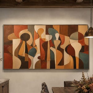 Può includere: Una grande opera d'arte murale rettangolare caratterizzata da una composizione astratta di forme curve e intrecciate nei toni dell'arancione bruciato, marrone scuro, crema e verde acqua, incorniciata da un sottile bordo metallico sopra un tavolo.