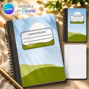 May include: A spiral-bound notebook featuring a light blue sky and green rolling hills design on the cover. A white rectangular label with the text COMPOSITION BOOK and four horizontal lines is centered. A gold pen lies near the notebook.