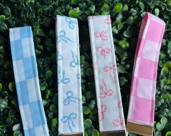 Cutesy Bows and Checkered Wristlets with Durable Hardware