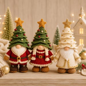 May include: Three crocheted dolls featuring Christmas tree hats topped with yellow stars. Two dolls wear green tree hats with red and white beads, one in a red coat and one in a red dress. The third doll wears a cream tree hat with gold beads and wings.