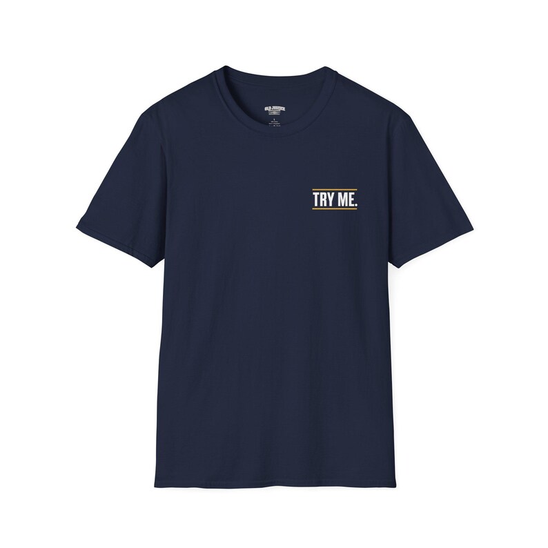A black t-shirt with the text "TRY ME" printed on the front.
