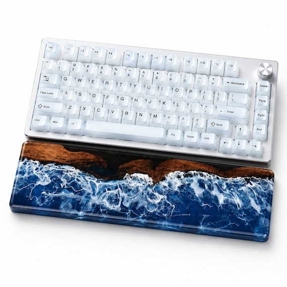 Hand-painted African blackwood and resin wrist rest that turns an ergonomic desk essential into a one-of-a-kind art piece — no two are alike.
