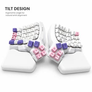 May include: A split ergonomic mechanical keyboard with white, pink, and purple keycaps. The text TILT DESIGN and Ergonomic angle for natural wrist alignment appear above the device. The keyboard features two separate halves, each with an attached white wrist rest.