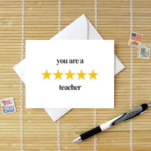 May include: A white card with the text "you are a" and five yellow stars. Below the stars is the text "teacher".