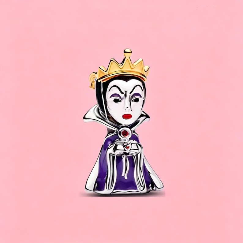 May include: A silver-toned metal charm shaped like a queen figure wearing a gold crown, a high-collared purple cape, and holding a small red-accented object. The figure has a white face, black hair, and red lips, with a polished metallic finish.