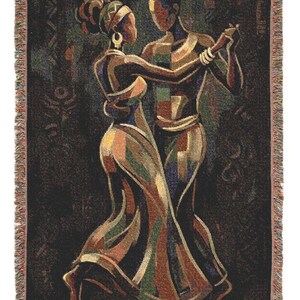 May include: A woven throw blanket featuring a dark background with a colorful, stylized depiction of two figures dancing. The design uses geometric shapes in shades of gold, green, blue, and red to form the silhouettes of the dancers with fringed edges.