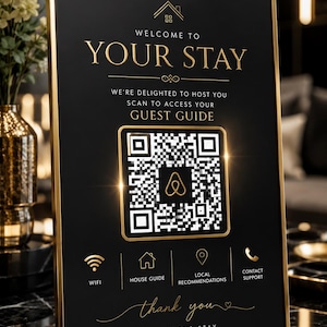 May include: A rectangular black sign with a gold frame featuring the text WELCOME TO YOUR STAY, a central QR code with an Airbnb logo, and icons for WiFi, house guide, local recommendations, and contact support, ending with thank you.