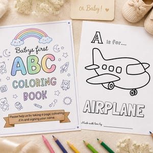 Puede incluir: Un libro para colorear titulado Babys first ABC COLORING BOOK con un arcoíris y estrellas, junto a una página con una ilustración de un avión y el texto A is for AIRPLANE y Made with love by, acompañado de varios lápices de colores.
