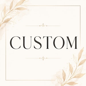 May include: A square graphic featuring the word CUSTOM in large black serif capital letters centered within a thin gold rectangular frame. The corners are decorated with watercolor-style beige and tan botanical leaf illustrations.