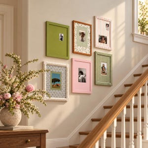 May include: A gallery wall arrangement featuring five rectangular picture frames in various colors and textures, including solid green, wood grain, striped, beaded white, and solid pink, each displaying a unique photograph.