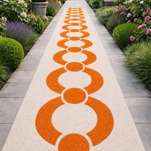 May include: A long rectangular runner rug featuring a cream-colored base with a repeating geometric pattern of vibrant orange circles and interlocking semi-circles that increase in size from the top to the bottom of the rug's length.