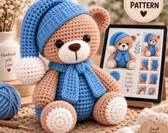 May include: A crocheted tan teddy bear wearing a blue nightcap with a white pom-pom and a matching blue scarf. A tablet displays a crochet pattern with the text CROCHET PATTERN, Make, Create, Cuddle, Repeat, and Small Stitches Big Joy.