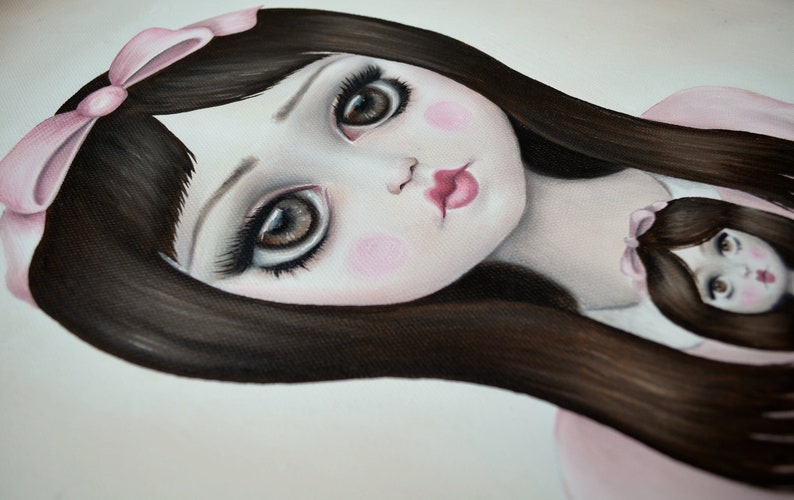 May include: A painting of a doll with long dark hair, wearing a pink bow and a pink dress. The doll has large brown eyes and rosy cheeks. A smaller doll is visible in the background.