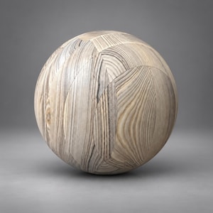 Puede incluir: Un objeto esférico construido a partir de múltiples segmentos de madera de color claro. La superficie muestra un patrón de veta natural prominente con diversos tonos de beige, bronceado y gris, dispuestos en un diseño geométrico de mosaico.