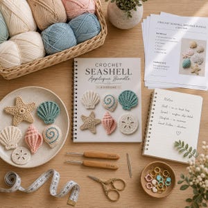 May include: A crochet seashell applique bundle kit including a spiral-bound pattern book, six crocheted sea life pieces on a plate, two wooden-handled crochet hooks labeled 2.5mm and 3.5mm, a measuring tape, scissors, and stitch markers.