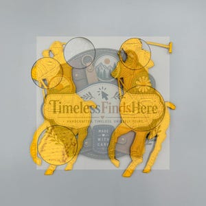 May include: Two yellow embroidered patches featuring a polo player on horseback holding a mallet. The patches are layered over a circular logo with the text TimelessFindsHere, Handcrafted, Timeless, Uniquely Yours, and Made With Care.