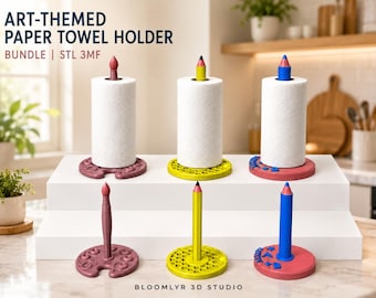 May include: Six art-themed paper towel holders featuring bases shaped like paint palettes and central spindles designed as pencils. Three holders are shown with white paper towel rolls, while three are empty. Colors include maroon, yellow, and blue.