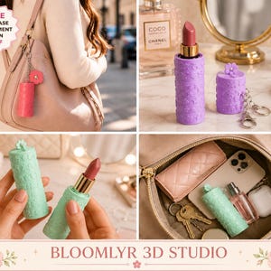 May include: A bundle of lipstick cases with ornament keychains in pink, purple, and mint green. Each cylindrical case features a textured floral pattern and a small flower charm attached to a metal keyring. The cases are shown holding lipstick.