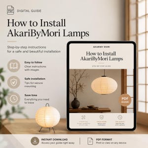 May include: A digital PDF guide titled How to Install AkariByMori Lamps, featuring step-by-step instructions for lamp installation. The graphic displays a round paper lantern on a table and a tablet screen showing the same guide cover.