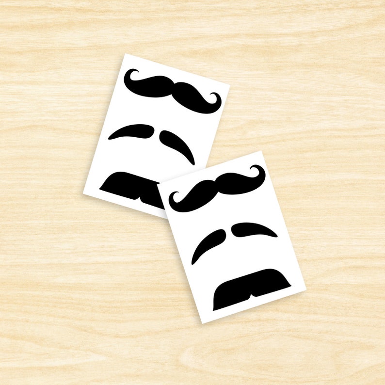 2-sheet set of finger mustache temporary tattoos featuring 6 unique black mustache styles including handlebar, chevron, and pencil stache designs. Hilarious and fun fake tattoos perfect for photo booths, parties, Halloween, Movember, gag gifts, or bachelorette fun. A bestselling classic that brings instant laughs. Easy to apply, safe on skin, and sized to sit right above your finger for that perfect faux-stache moment.