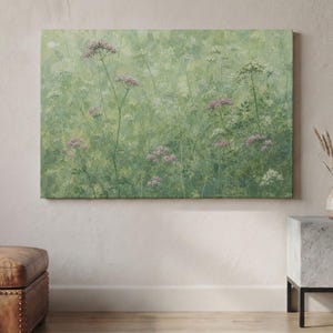 May include: A rectangular canvas wall art piece featuring an impressionistic painting of a meadow. The artwork displays various shades of green foliage with scattered clusters of small, delicate pink and white wildflowers throughout the scene.