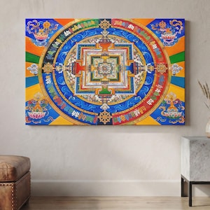 May include: A rectangular wall art print featuring a vibrant Kalachakra mandala with intricate geometric patterns, concentric circles, and Sanskrit script. The design displays a rich palette of blue, orange, yellow, green, and red hues.