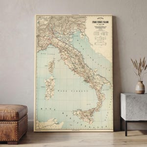 May include: A vintage-style wall map titled Strade Ferrate Italiane dated April 7, 1901, featuring a detailed beige and light blue illustration of the Italian peninsula, including Sicily and Sardinia, with railway lines and a legend in the corner.