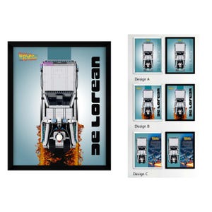 May include: A framed wall art print featuring a top-down view of a silver DeLorean car model from Back to the Future. The car is depicted with orange flames trailing behind it on a light blue background. The text DeLorean is printed vertically.