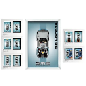 May include: A framed poster featuring a top-down view of a silver DeLorean car. The design includes the text "DE LOREAN" vertically and "DMC DE LOREAN MOTOR COMPANY" at the bottom. The image displays five variations labeled Design A through E.