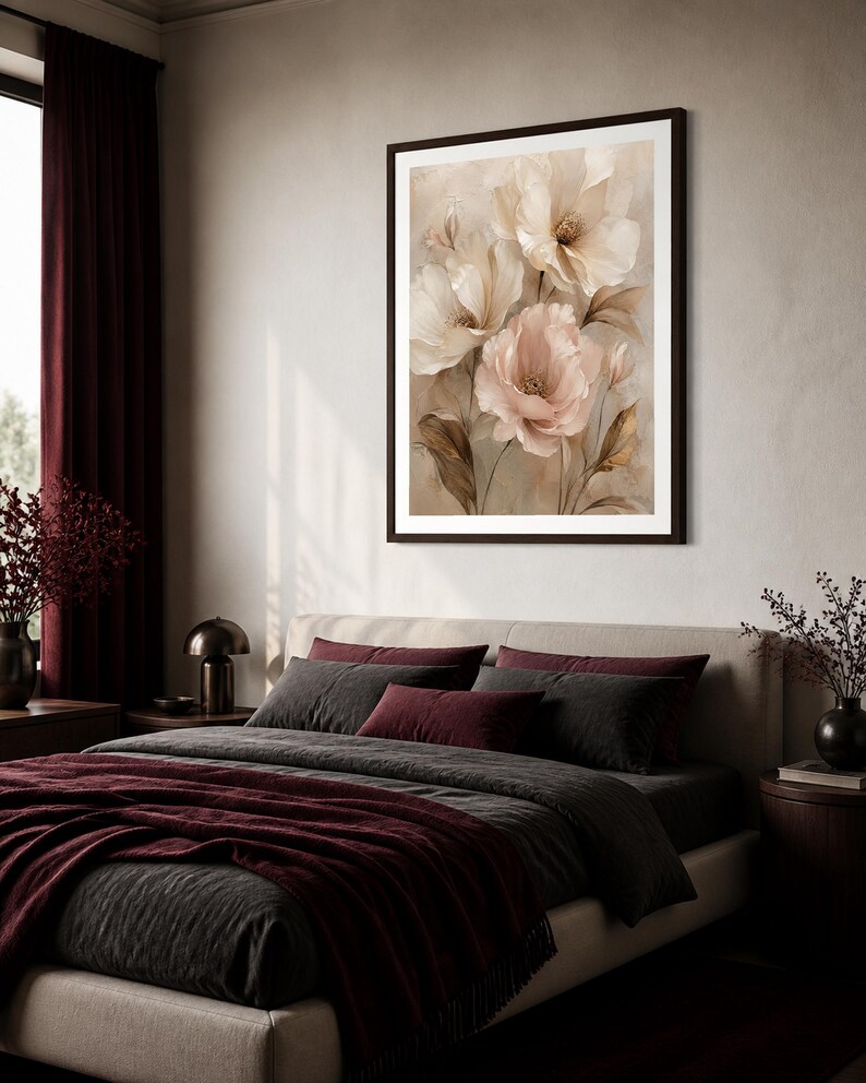 May include: A framed wall art print featuring a botanical illustration of large, layered flowers in shades of cream, beige, and soft pink. The artwork displays delicate petals and slender stems against a neutral, muted background, enclosed in a dark frame.
