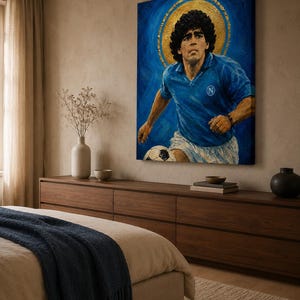 May include: A rectangular canvas wall art print featuring a portrait of a soccer player with curly dark hair, wearing a blue jersey with a white N logo and white shorts, set against a deep blue background with a prominent gold circular halo.