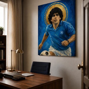 May include: A rectangular canvas painting depicting a soccer player with curly dark hair wearing a blue jersey with a white N logo and white shorts. The player is positioned against a deep blue background with a prominent gold circular halo.