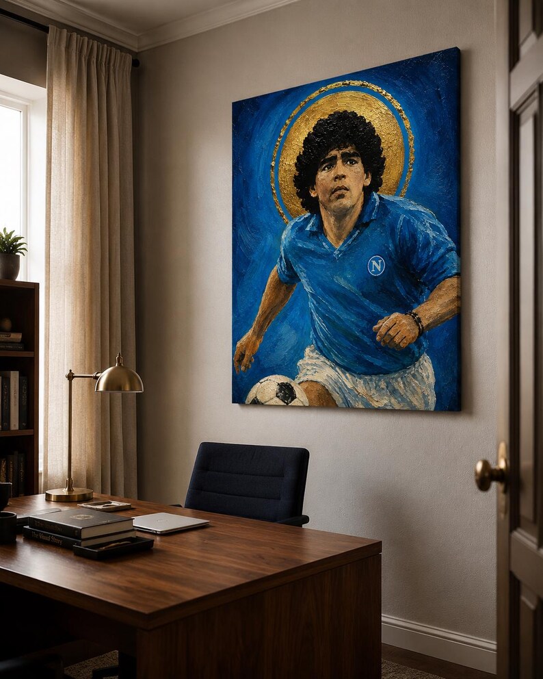 May include: A rectangular canvas painting depicting a soccer player with curly dark hair wearing a blue jersey with a white N logo and white shorts. The player is positioned against a deep blue background with a prominent gold circular halo.