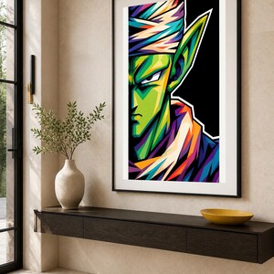May include: A framed vertical wall art print featuring a stylized, colorful pop-art portrait of a green-skinned character with pointed ears, wearing a white turban and a purple garment, set against a solid black background with vibrant highlights.