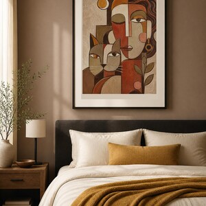 May include: A framed wall art print featuring a stylized cubist-inspired portrait of a person and a cat. The composition uses a warm color palette of terracotta, beige, and brown, with geometric shapes defining the facial features and feline form.