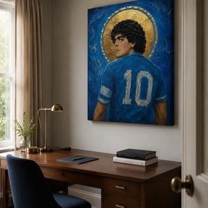 May include: A rectangular canvas painting featuring a portrait of a footballer with curly dark hair, wearing a blue jersey with the number 10 on the back. The figure is set against a deep blue background with a prominent circular gold halo.