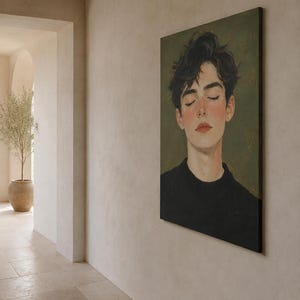 May include: A rectangular canvas wall art piece featuring a portrait of a person with dark, tousled hair and closed eyes. The subject wears a black sweater against a muted olive green background, rendered in a painterly style with soft lighting.