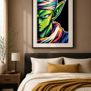 May include: A framed wall art print featuring a stylized, vibrant portrait of the character Piccolo from Dragon Ball. The artwork uses bold, geometric color blocking in shades of green, purple, orange, and white against a solid black background.