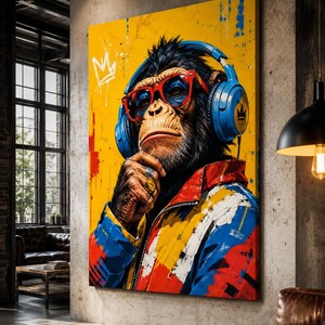 May include: A vertical canvas wall art print featuring a chimpanzee wearing bright blue headphones, red-rimmed glasses, and a colorful jacket with red, blue, and yellow patterns. A white crown icon is painted on the vibrant yellow background.
