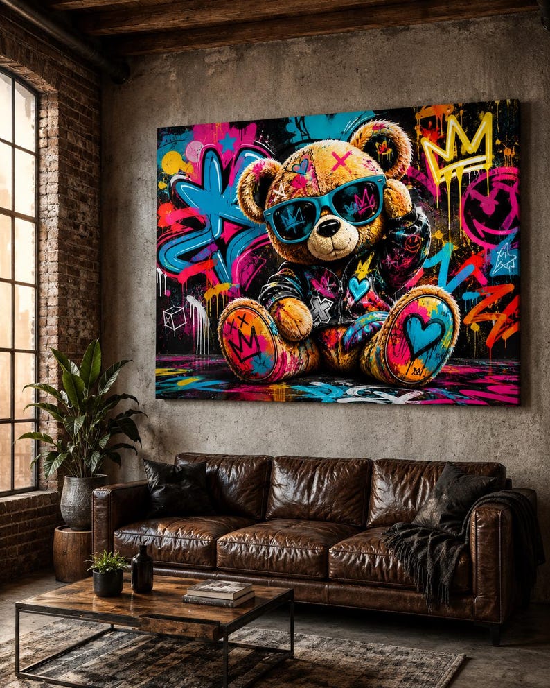 May include: A rectangular wall art print featuring a brown teddy bear wearing blue sunglasses and a dark jacket. The bear is surrounded by vibrant graffiti-style artwork including bright pink, blue, and yellow paint splatters, crowns, and hearts.