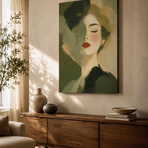 May include: A rectangular wall art print featuring an impressionistic portrait of a person with closed eyes. The figure is rendered in shades of olive green, cream, and black, with a striking pop of bright red lipstick on the lips.
