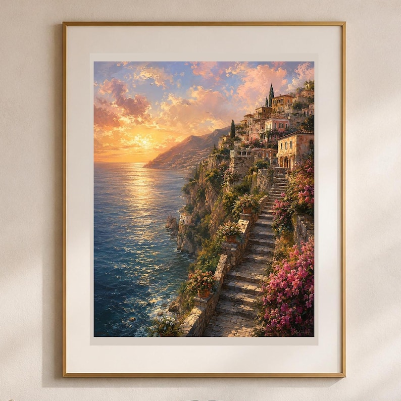 Peut inclure: Une impression d'art mural encadr&eacute;e repr&eacute;sentant un village c&ocirc;tier &agrave; flanc de falaise au coucher du soleil. La sc&egrave;ne montre des escaliers en pierre descendant vers la mer, entour&eacute;s de fleurs roses et de verdure, sous une lumi&egrave;re dor&eacute;e.