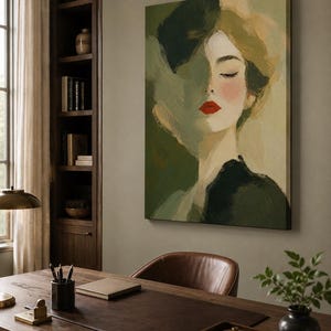 May include: A rectangular canvas wall art piece featuring an impressionistic portrait of a person with closed eyes, painted in shades of olive green, sage, and cream, with a striking pop of bright red lipstick on the lips and dark green clothing.