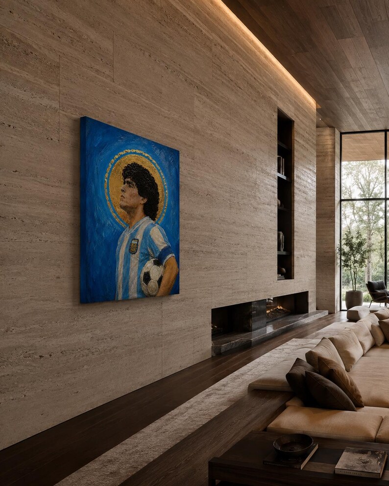 May include: A rectangular canvas painting featuring a portrait of a soccer player with curly dark hair, wearing a blue and white striped jersey, holding a soccer ball, set against a blue background with a prominent gold circular halo behind the head.