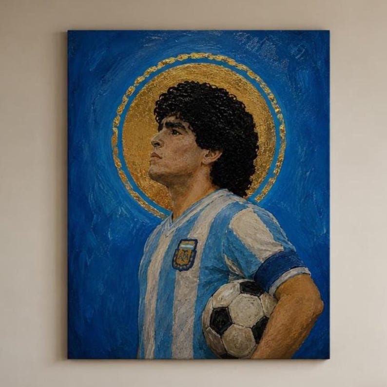 May include: A textured oil painting on canvas depicting a soccer player with curly dark hair wearing a light blue and white striped jersey. The player holds a black and white soccer ball, set against a deep blue background with a gold halo.