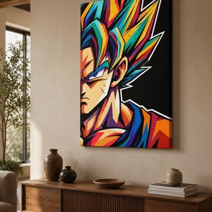 Op de afbeelding: Een rechthoekige canvas print met een gestileerd, levendig pop-art portret van een personage met stekelig haar. Het kunstwerk gebruikt gedurfde, verzadigde kleuren waaronder blauw, geel, oranje en rood tegen een effen zwarte achtergrond.