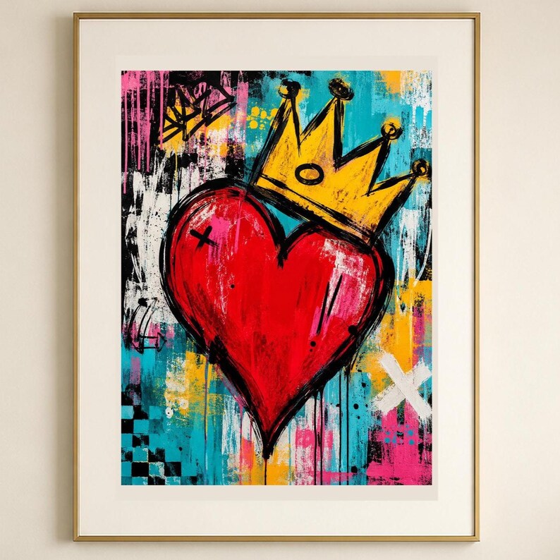 May include: A framed wall art print featuring a large, vibrant red heart topped with a yellow crown. The background is a chaotic mix of abstract paint splatters, drips, and brushstrokes in shades of bright blue, pink, yellow, black, and white.